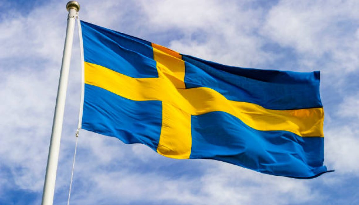 Swedish flag waving in the wind in the sky Swedish flag waving in the wind in the sky