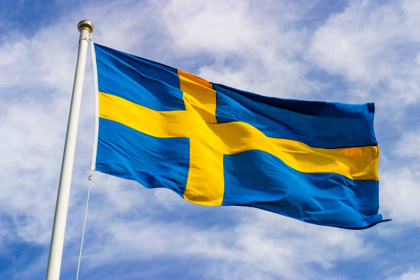 Swedish flag waving in the wind in the sky